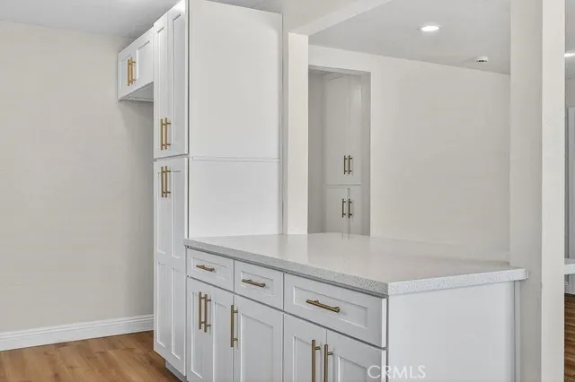 a view of cabinets and wooden floor