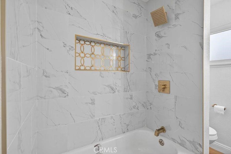 18222 10th Street Bloomington, CA 92316 - Photo 15 of 22 a bathroom with a bathtub and shower