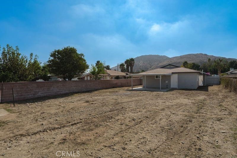 18222 10th Street Bloomington, CA 92316 - Photo 20 of 22 a view of a house with a yard