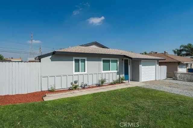 a front view of a house with a yard and porch