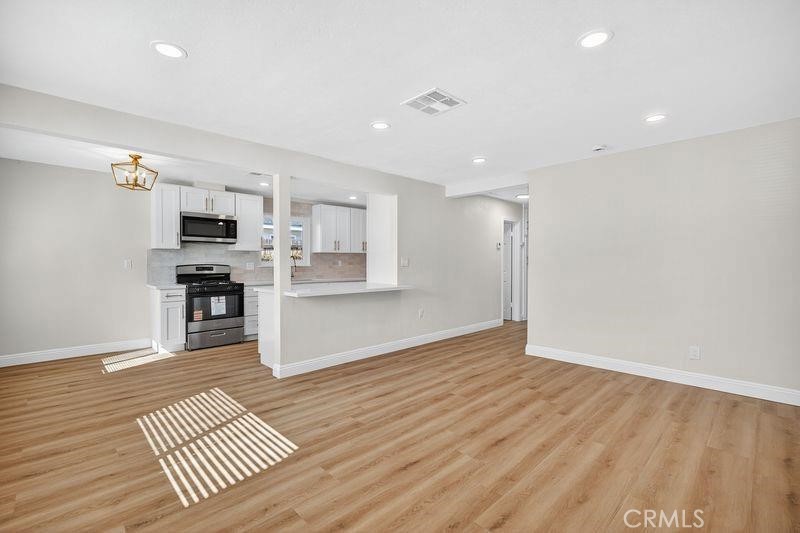 18222 10th Street Bloomington, CA 92316 - Photo 6 of 22 a view of kitchen with sink and refrigerator