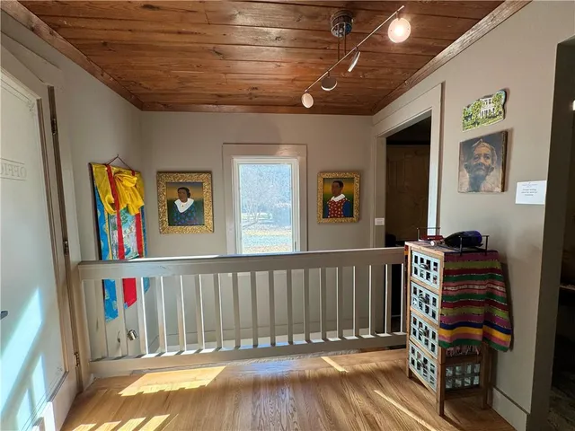 an aerial view of a house with swimming pool and garden