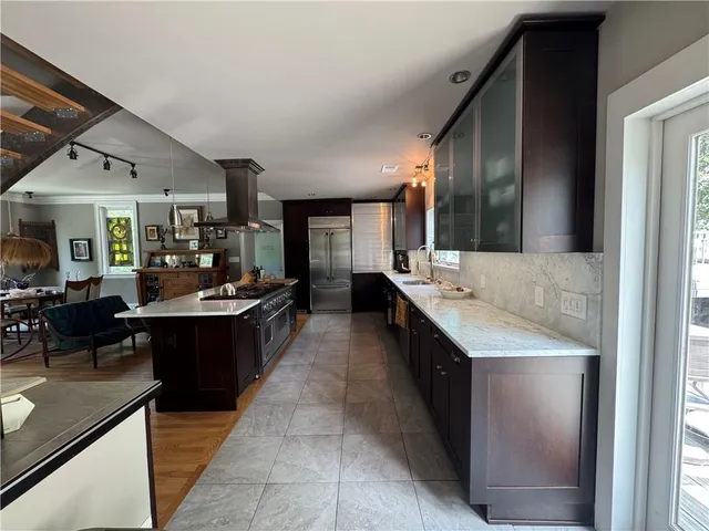 a bathroom with a double vanity sink and mirror