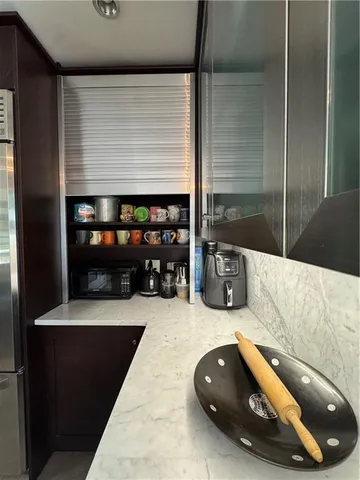 a bedroom with a bed couch and window