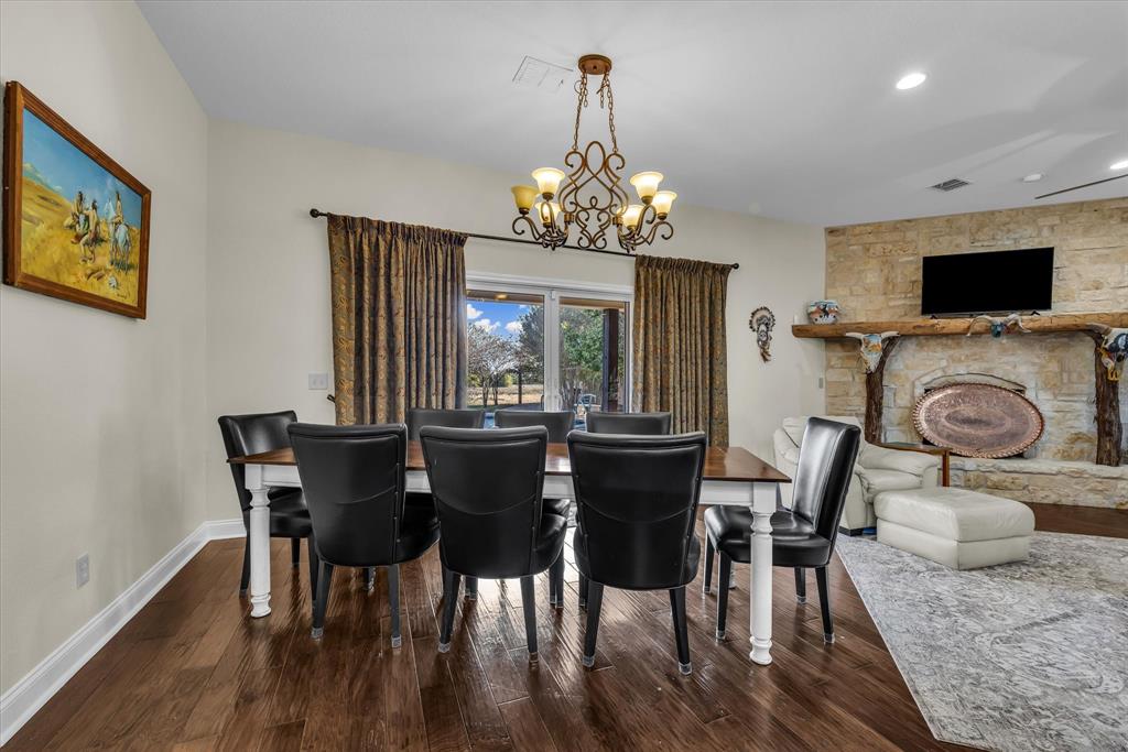 3439 Willow Branch Road McGregor, TX 76657 - Photo 12 of 40 a view of a dining room with furniture window and wooden floor