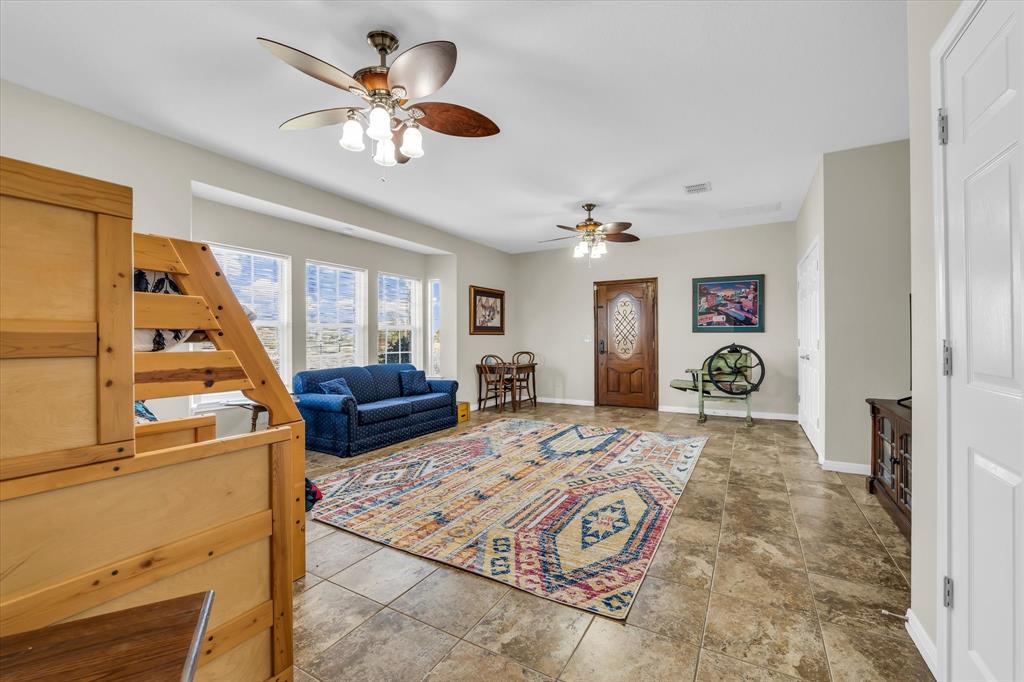 3439 Willow Branch Road McGregor, TX 76657 - Photo 22 of 40 a living room with furniture and a large window