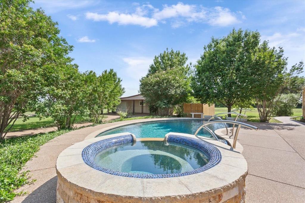 3439 Willow Branch Road McGregor, TX 76657 - Photo 28 of 40 a view of a swimming pool with a patio