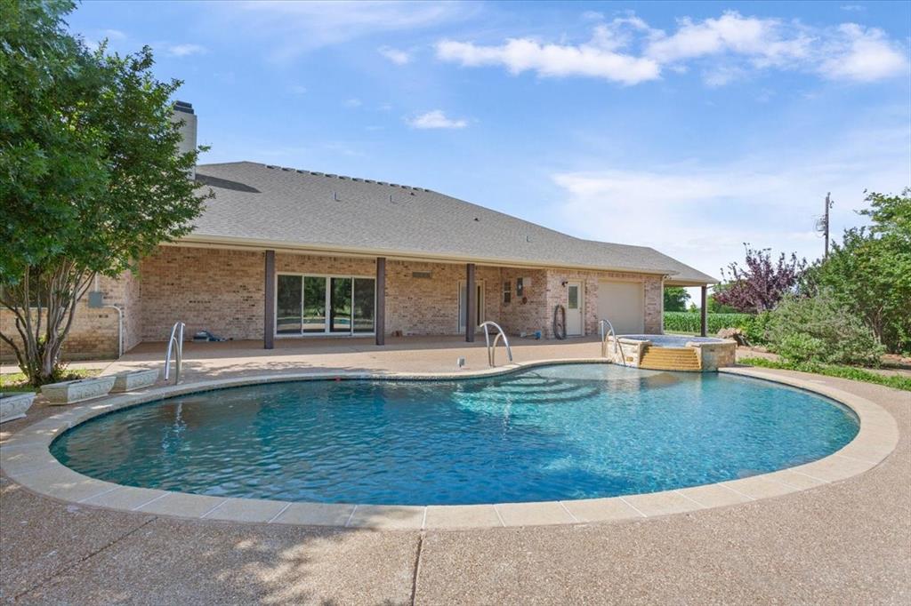 3439 Willow Branch Road McGregor, TX 76657 - Photo 29 of 40 a view of a house with swimming pool and sitting area