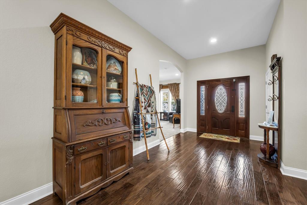3439 Willow Branch Road McGregor, TX 76657 - Photo 5 of 40 a view of a livingroom with wooden floor and furniture