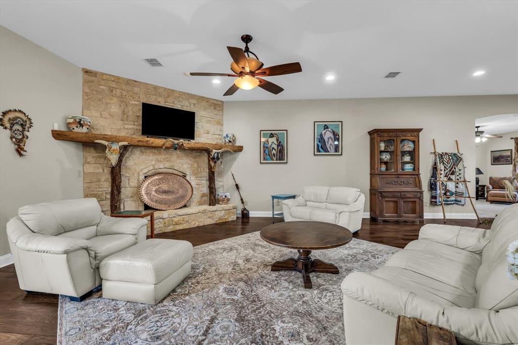 3439 Willow Branch Road McGregor, TX 76657 - Photo 8 of 40 a living room with furniture and a flat screen tv