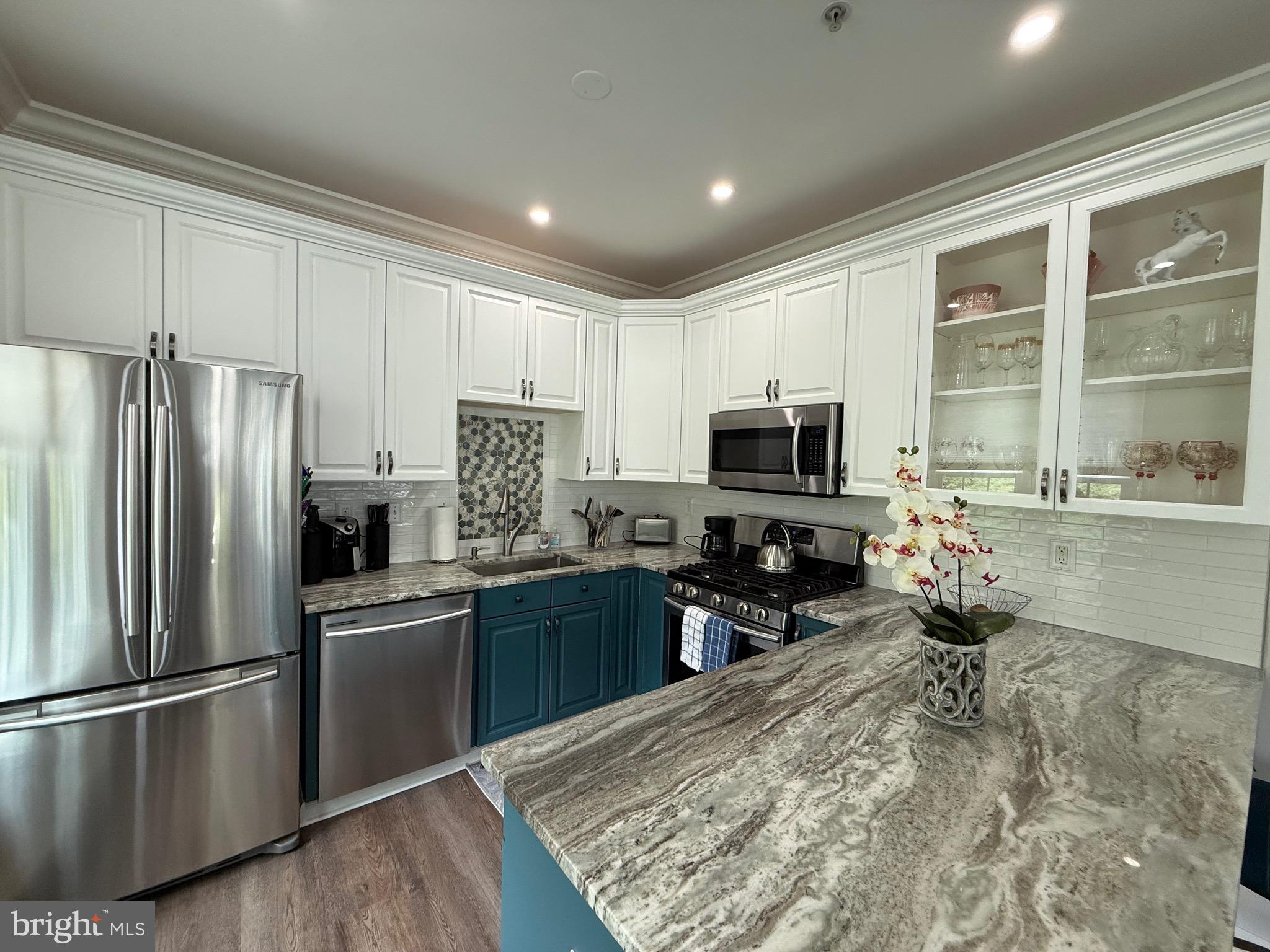 76 Kyle Way Ewing, NJ 08628 - Photo 12 of 38 a kitchen with stainless steel appliances granite countertop a refrigerator stove microwave and sink