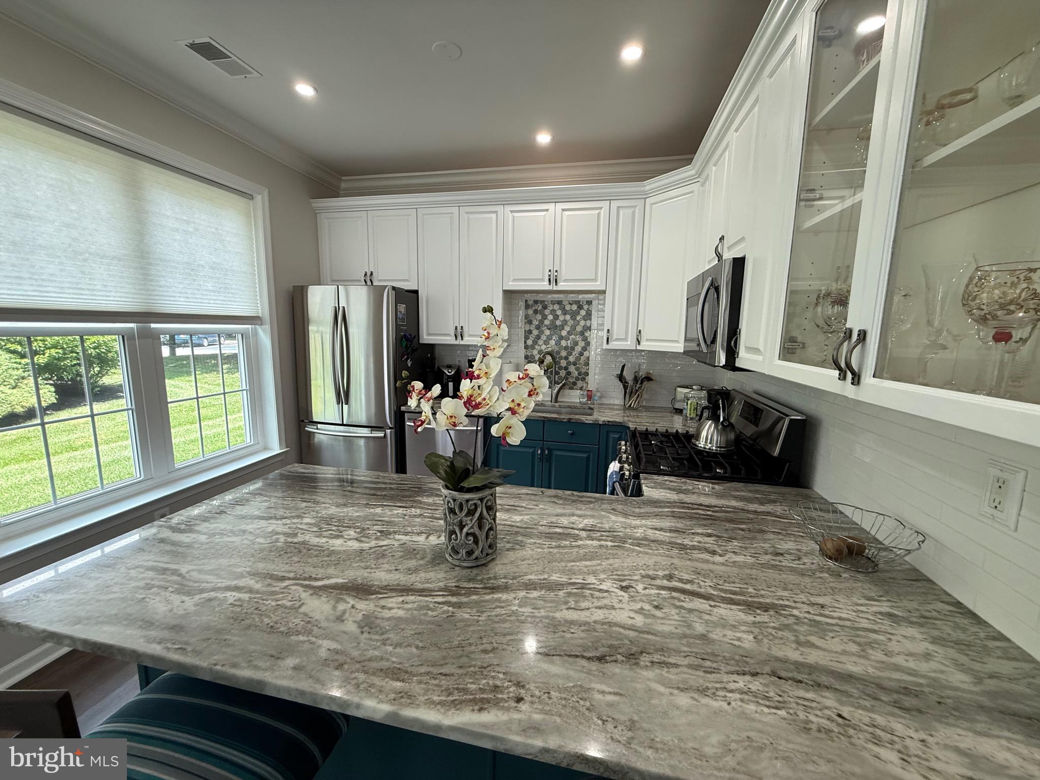 76 Kyle Way Ewing, NJ 08628 - Photo 13 of 38 a kitchen with sink refrigerator and window