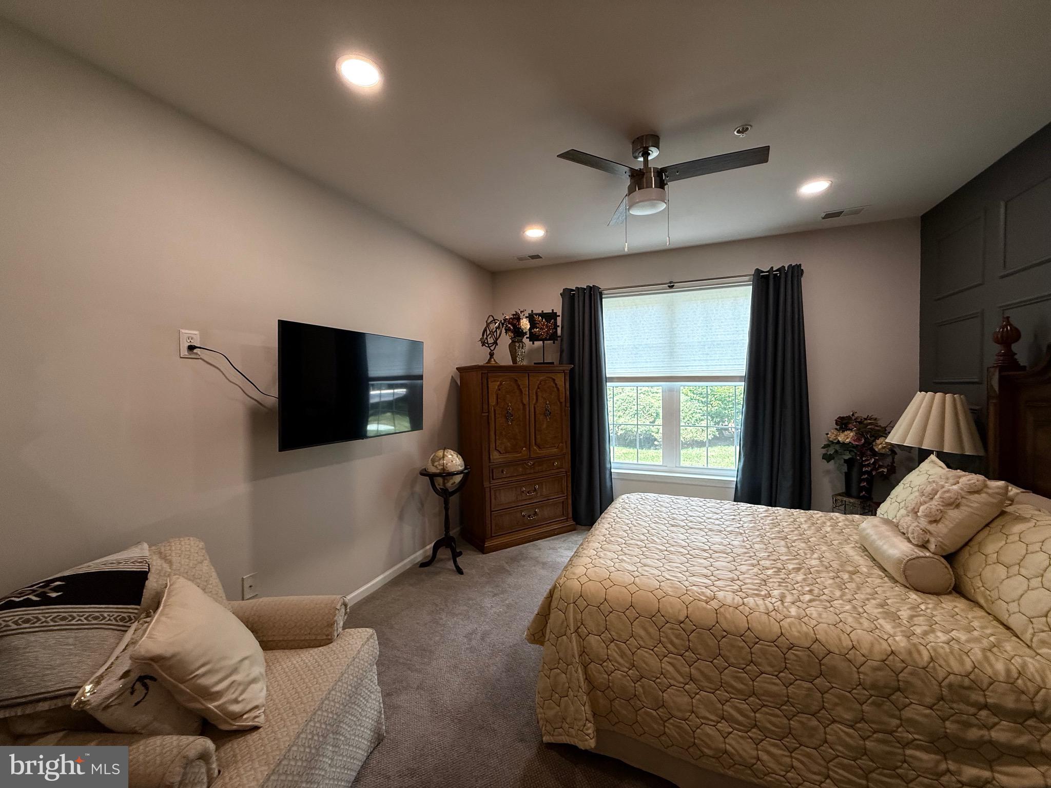 76 Kyle Way Ewing, NJ 08628 - Photo 18 of 38 a bedroom with a bed window and a television