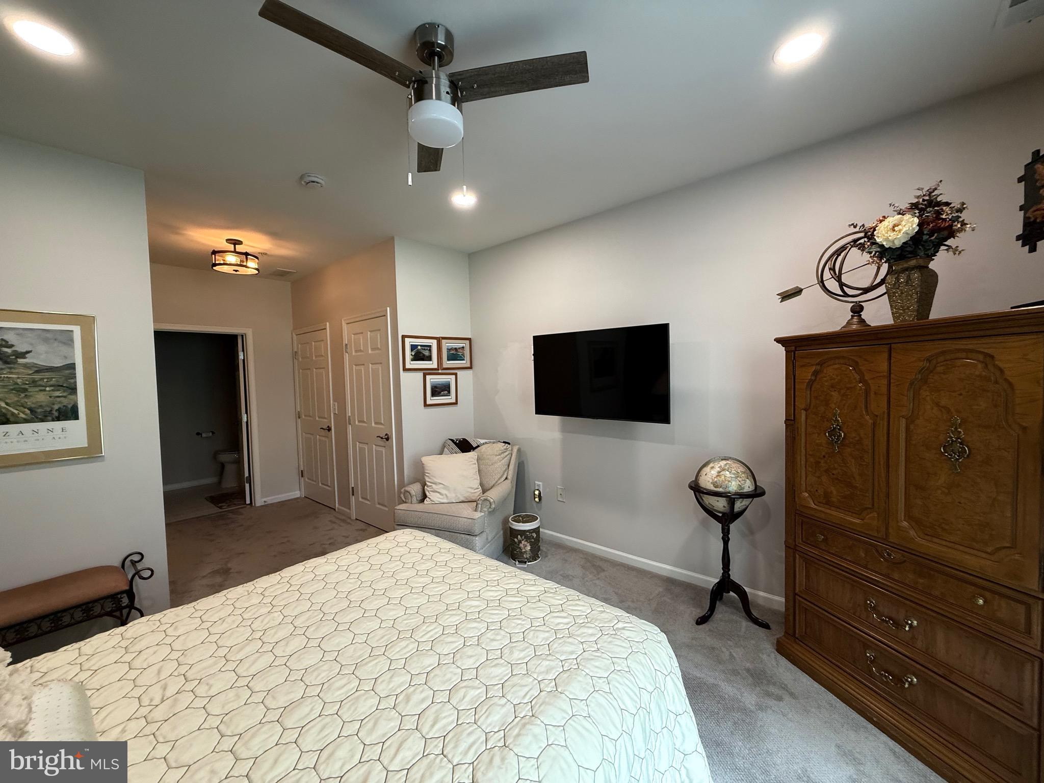 76 Kyle Way Ewing, NJ 08628 - Photo 20 of 38 a bedroom with a bed and a flat screen tv