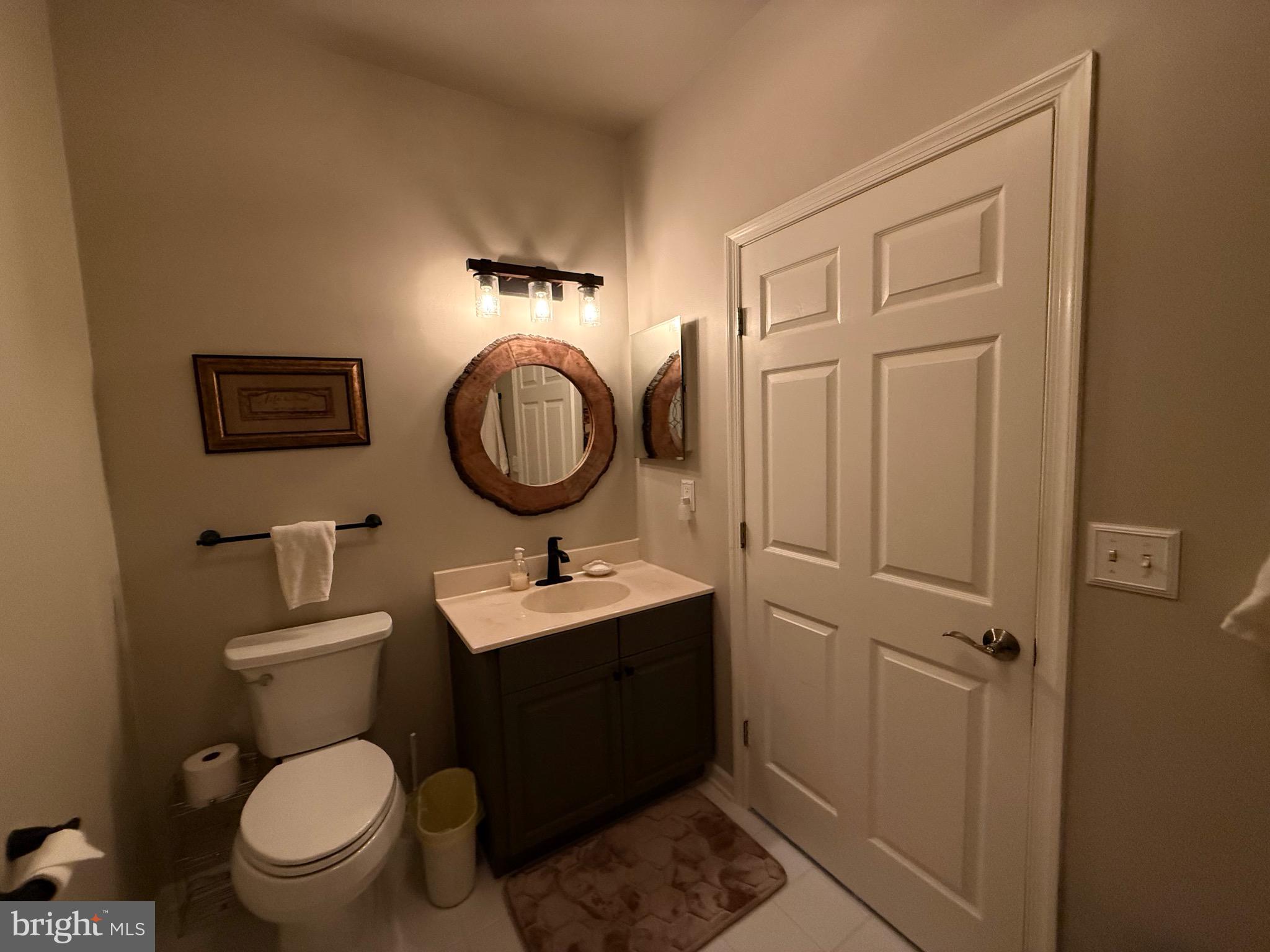 76 Kyle Way Ewing, NJ 08628 - Photo 26 of 38 a bathroom with a toilet a sink and mirror