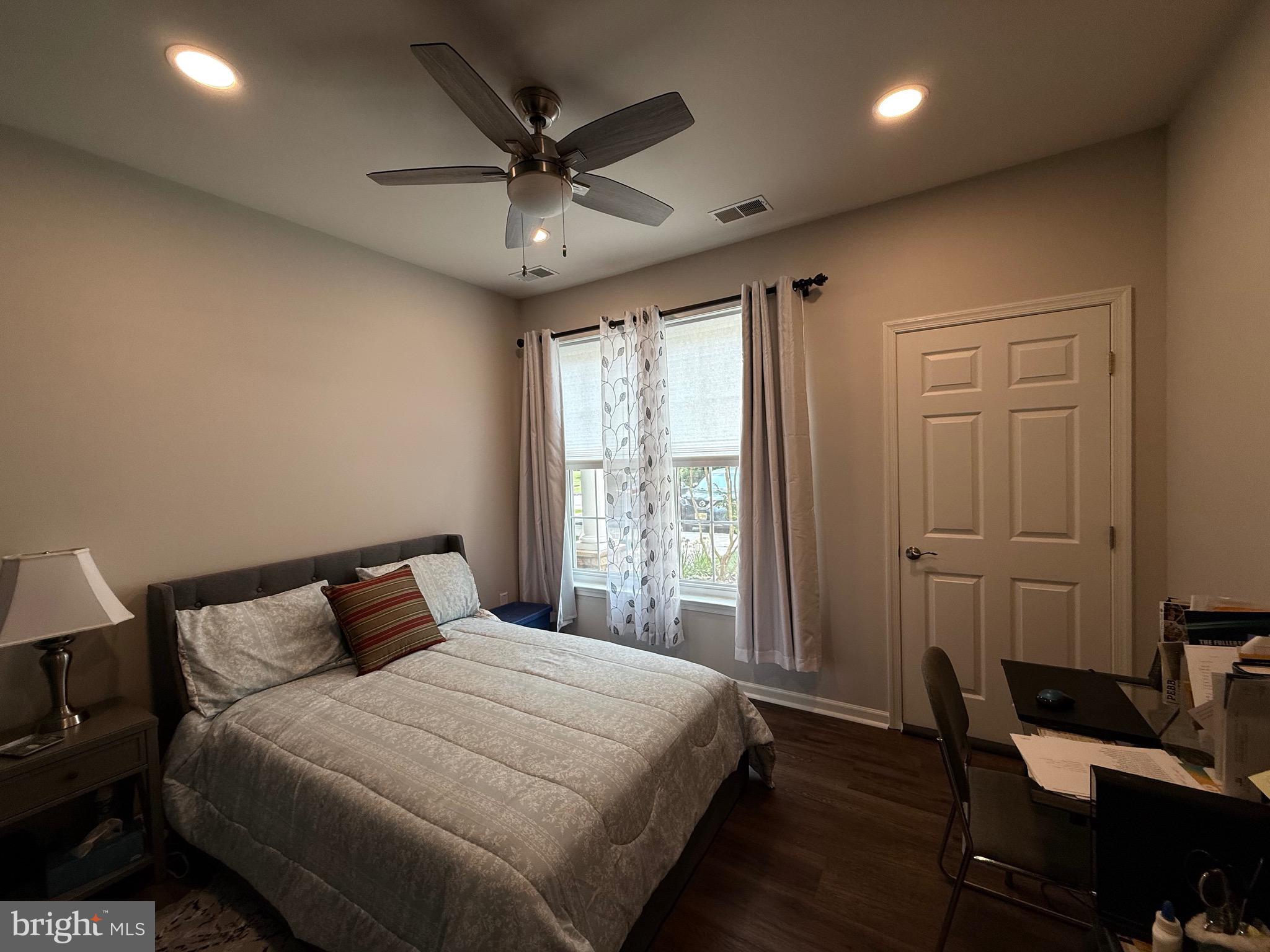 76 Kyle Way Ewing, NJ 08628 - Photo 30 of 38 a bedroom with a bed and a chandelier