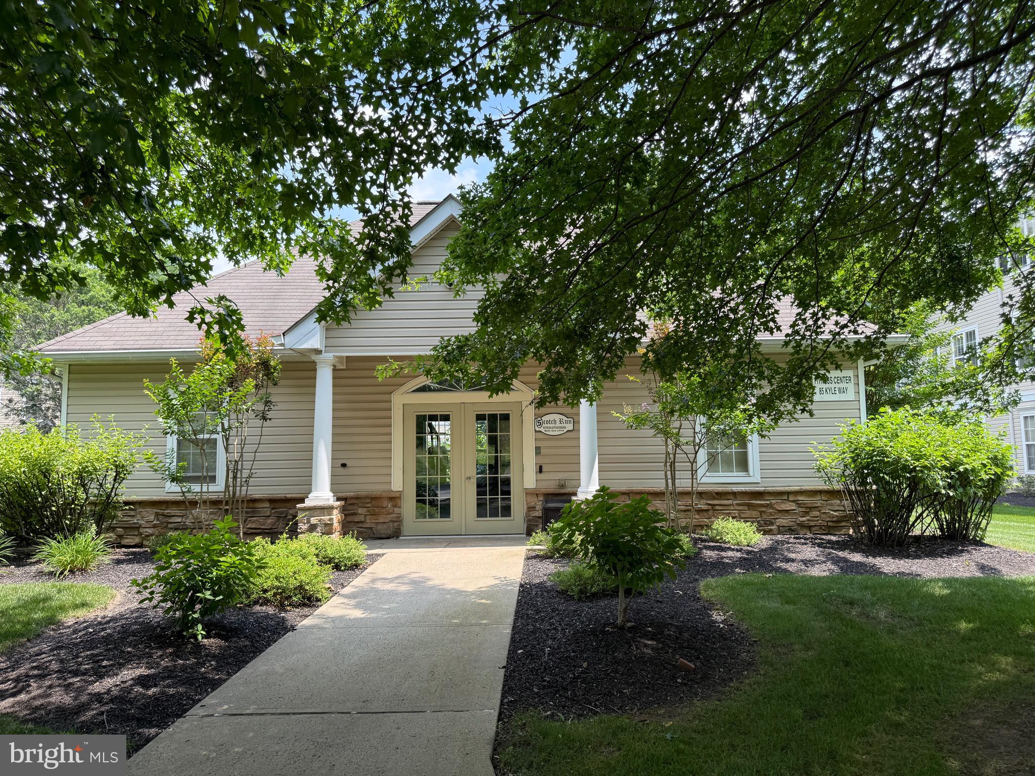 76 Kyle Way Ewing, NJ 08628 - Photo 37 of 38 a front view of a house with garden