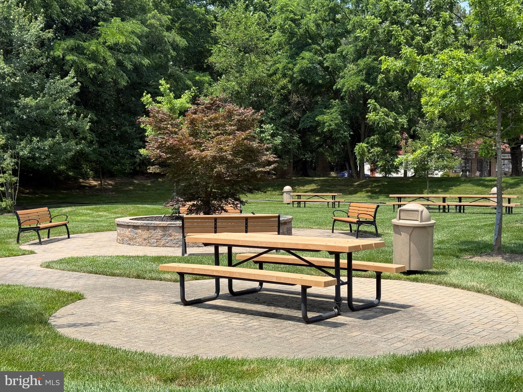 76 Kyle Way Ewing, NJ 08628 - Photo 38 of 38 a park bench sitting in the middle of a park