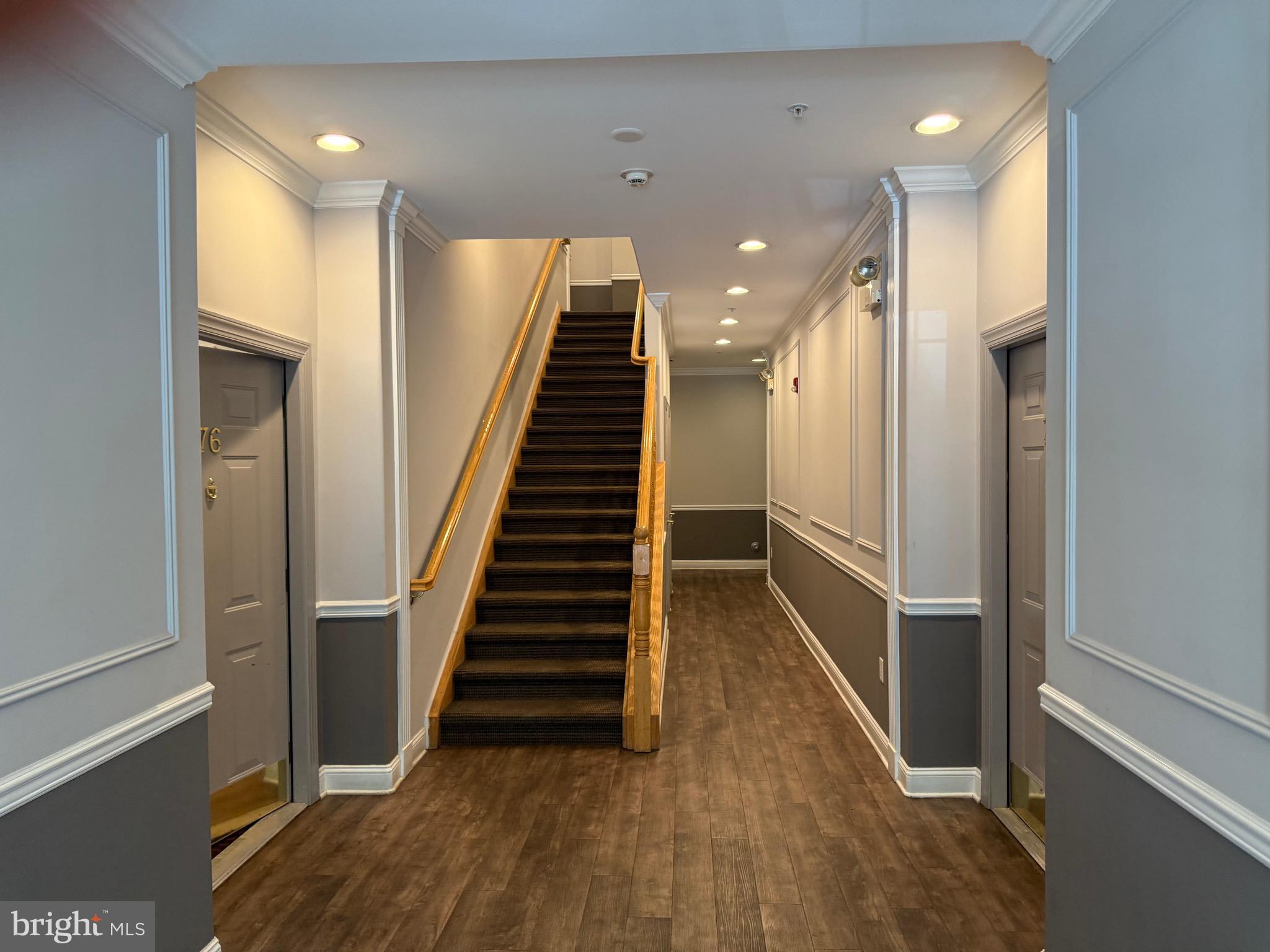 76 Kyle Way Ewing, NJ 08628 - Photo 5 of 38 a view of a hallway with wooden floor and staircase