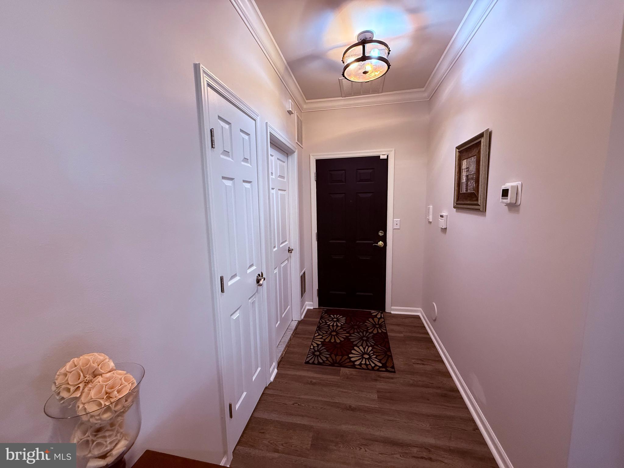 76 Kyle Way Ewing, NJ 08628 - Photo 6 of 38 a view of a hallway with wooden floor