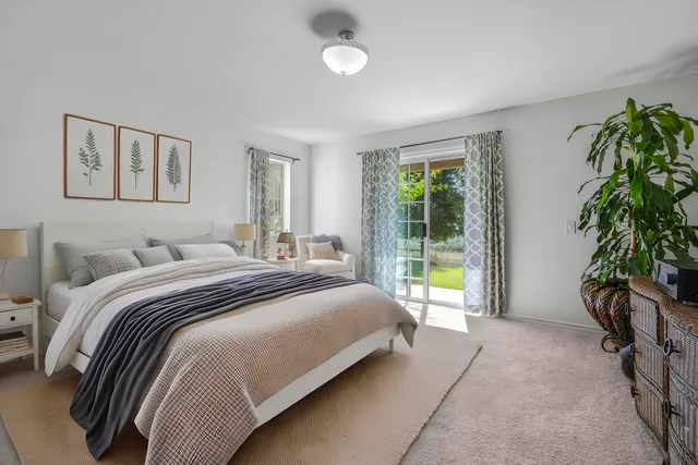 a wooden bench sitting in front of a house