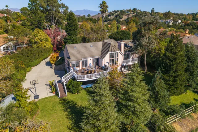 an aerial view of houses with yard