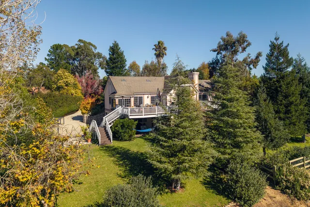 an aerial view of residential house and outdoor space