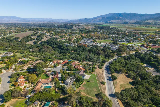an aerial view of a house with outdoor space