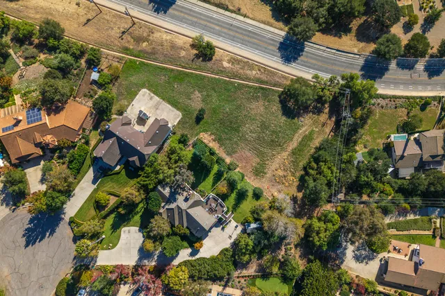 an aerial view of residential house and outdoor space