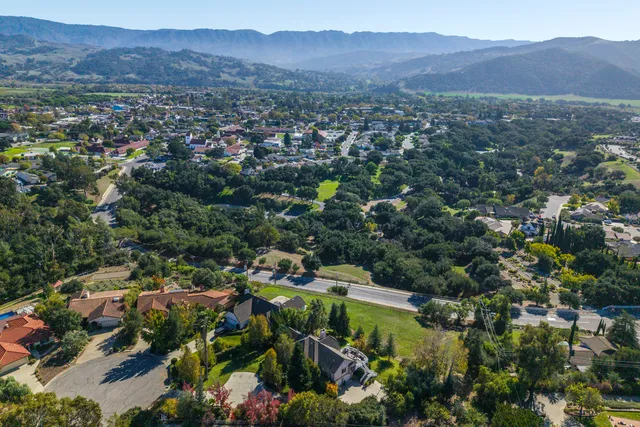 an aerial view of residential houses with outdoor space