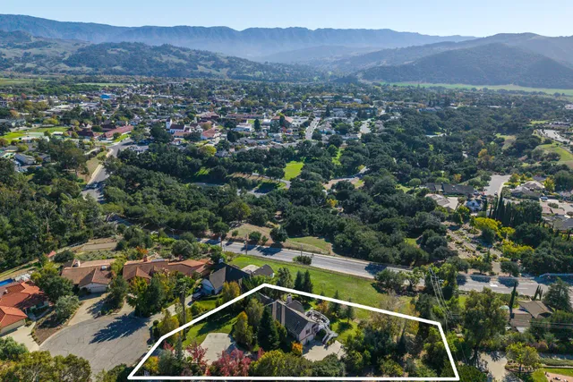 an aerial view of residential house and outdoor space