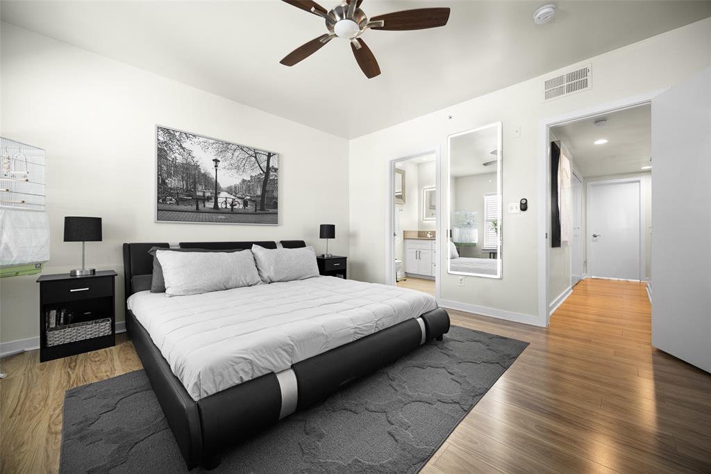 3922 Gilbert Avenue, Unit 214 Dallas, TX 75219 - Photo 12 of 27 Spacious room featuring wood-finish flooring, a ceiling fan, and recessed lighting