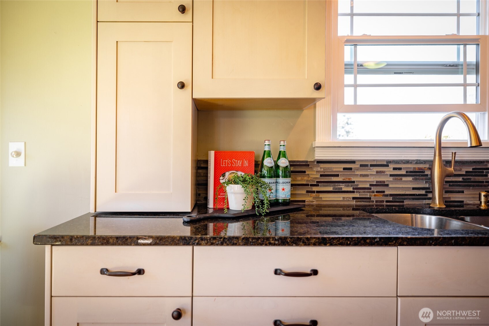 819 K Avenue Anacortes, WA 98221 - Photo 14 of 40 a kitchen with stainless steel appliances granite countertop a sink and a window