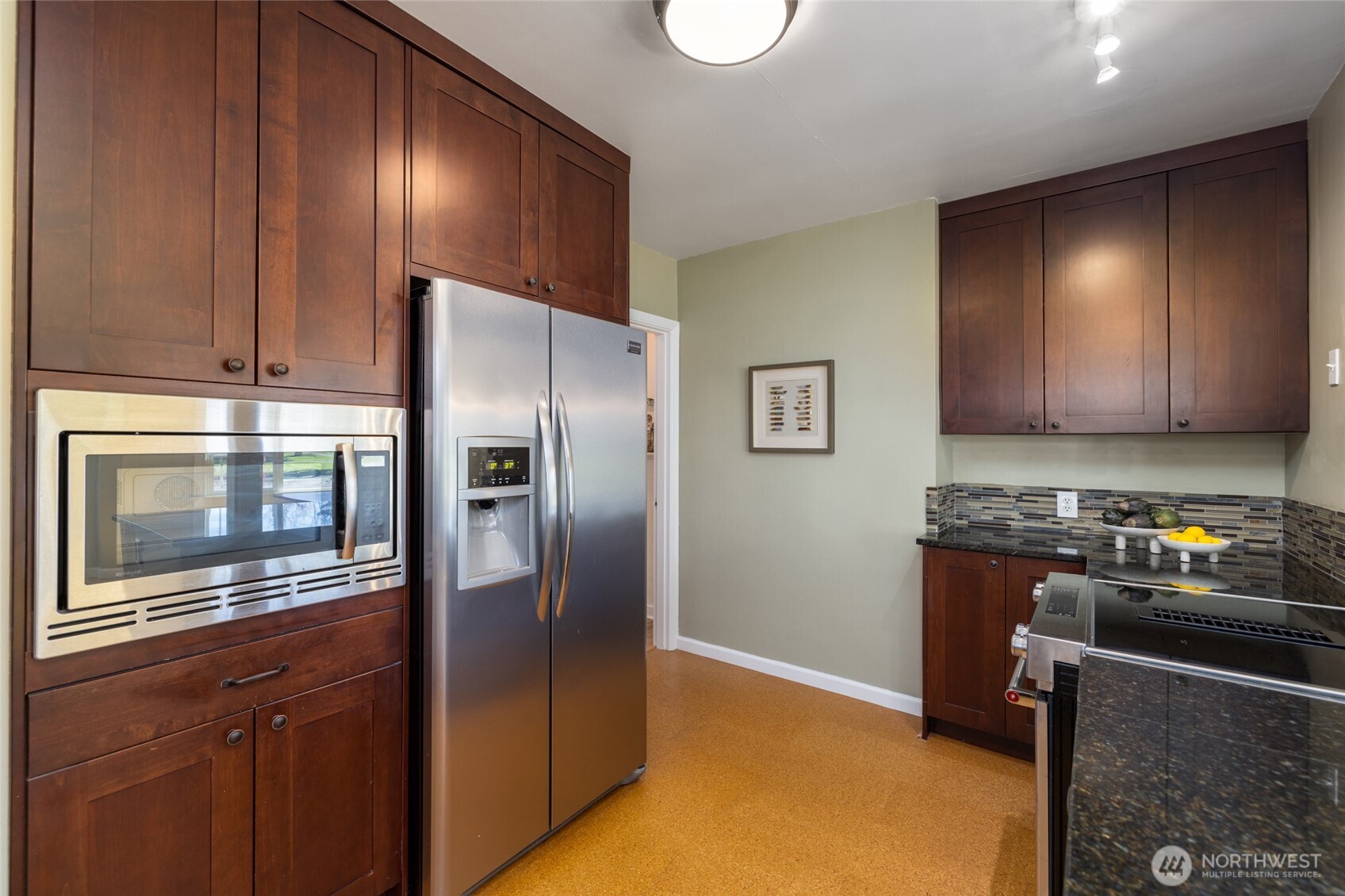 819 K Avenue Anacortes, WA 98221 - Photo 15 of 40 a kitchen with stainless steel appliances granite countertop a refrigerator stove and sink