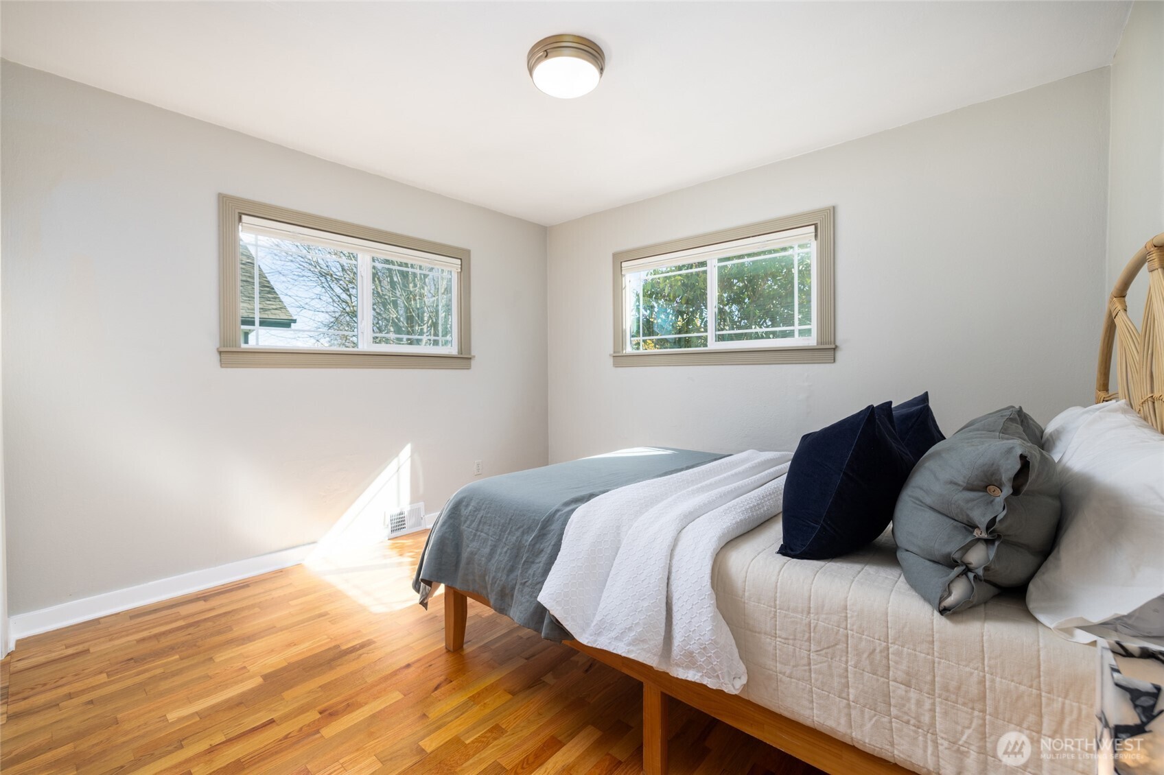 819 K Avenue Anacortes, WA 98221 - Photo 19 of 40 a bedroom with a bed and a window