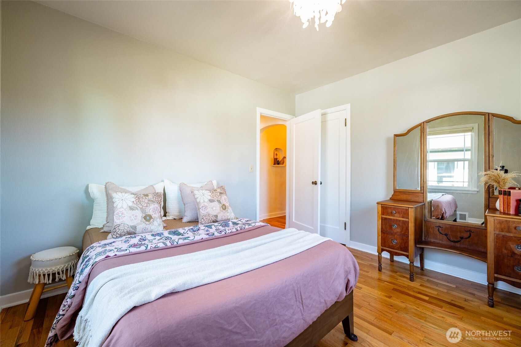 819 K Avenue Anacortes, WA 98221 - Photo 22 of 40 a bedroom with a bed and wooden floor