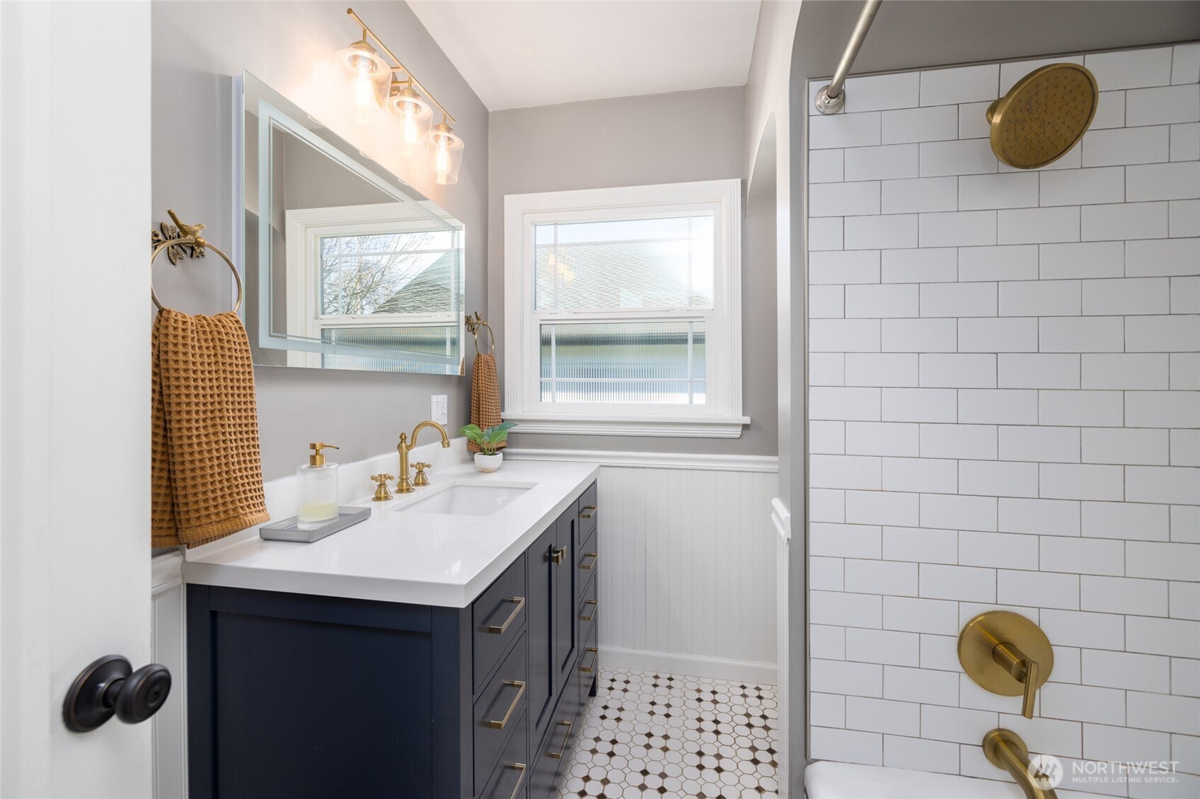 819 K Avenue Anacortes, WA 98221 - Photo 23 of 40 a bathroom with a sink and a mirror