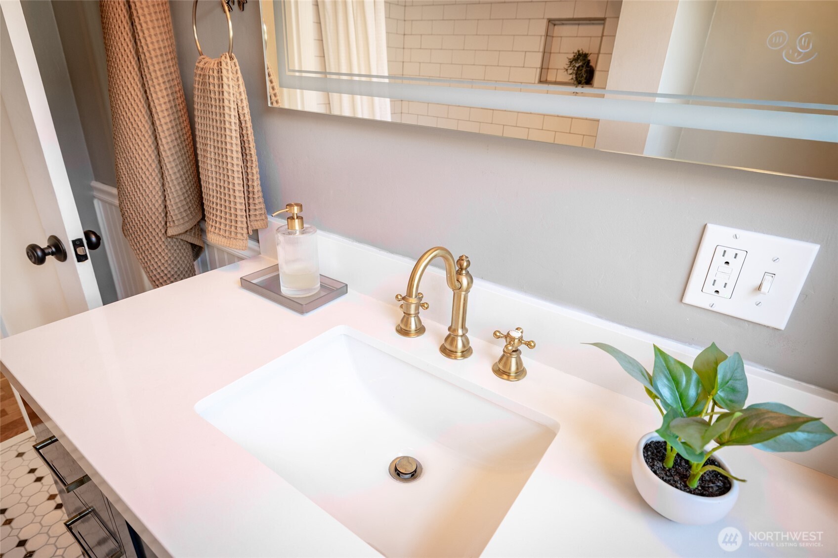 819 K Avenue Anacortes, WA 98221 - Photo 24 of 40 a bathroom with a sink a vanity and a potted plant