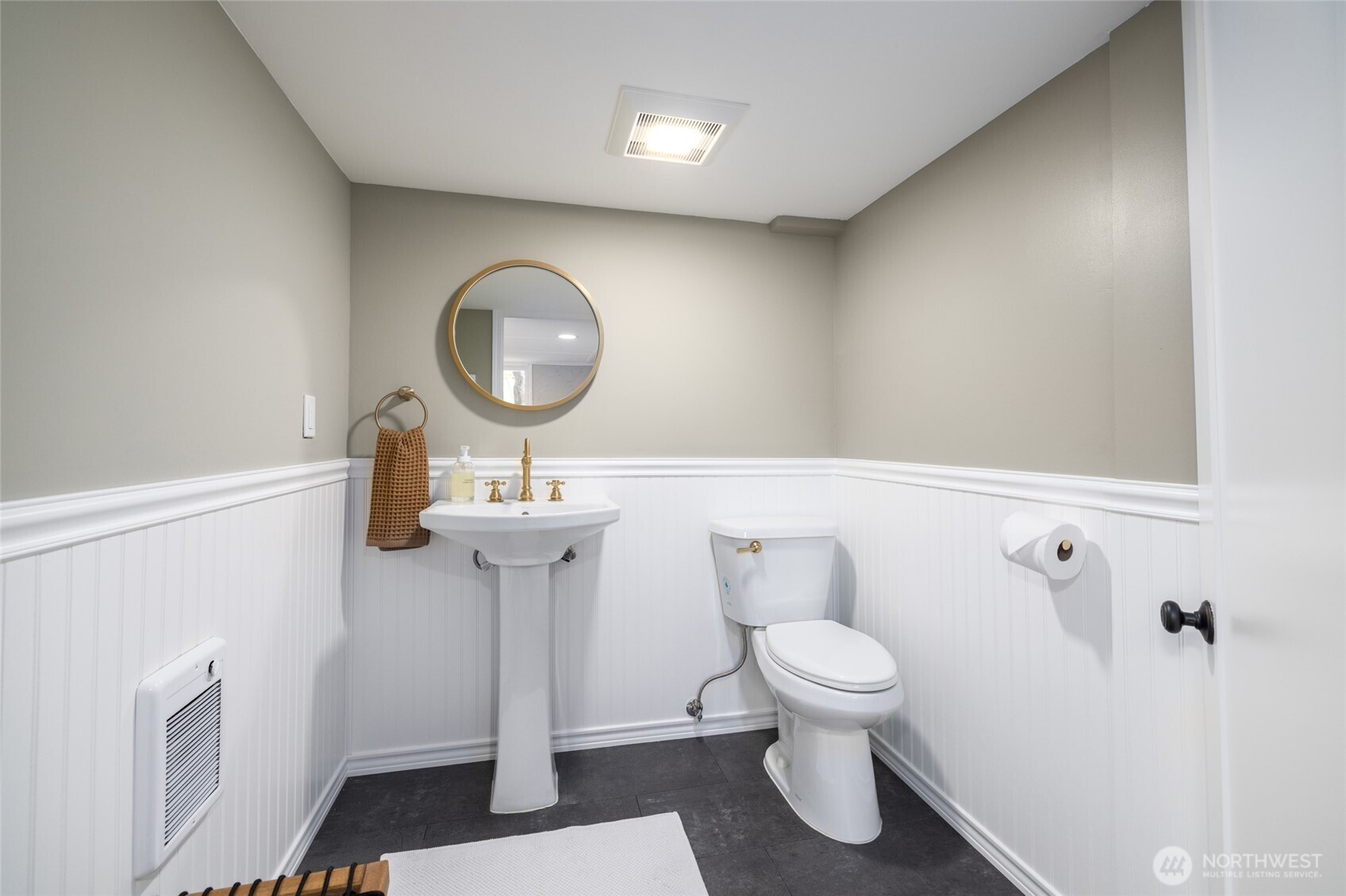 819 K Avenue Anacortes, WA 98221 - Photo 28 of 40 a bathroom with a toilet a sink and a mirror
