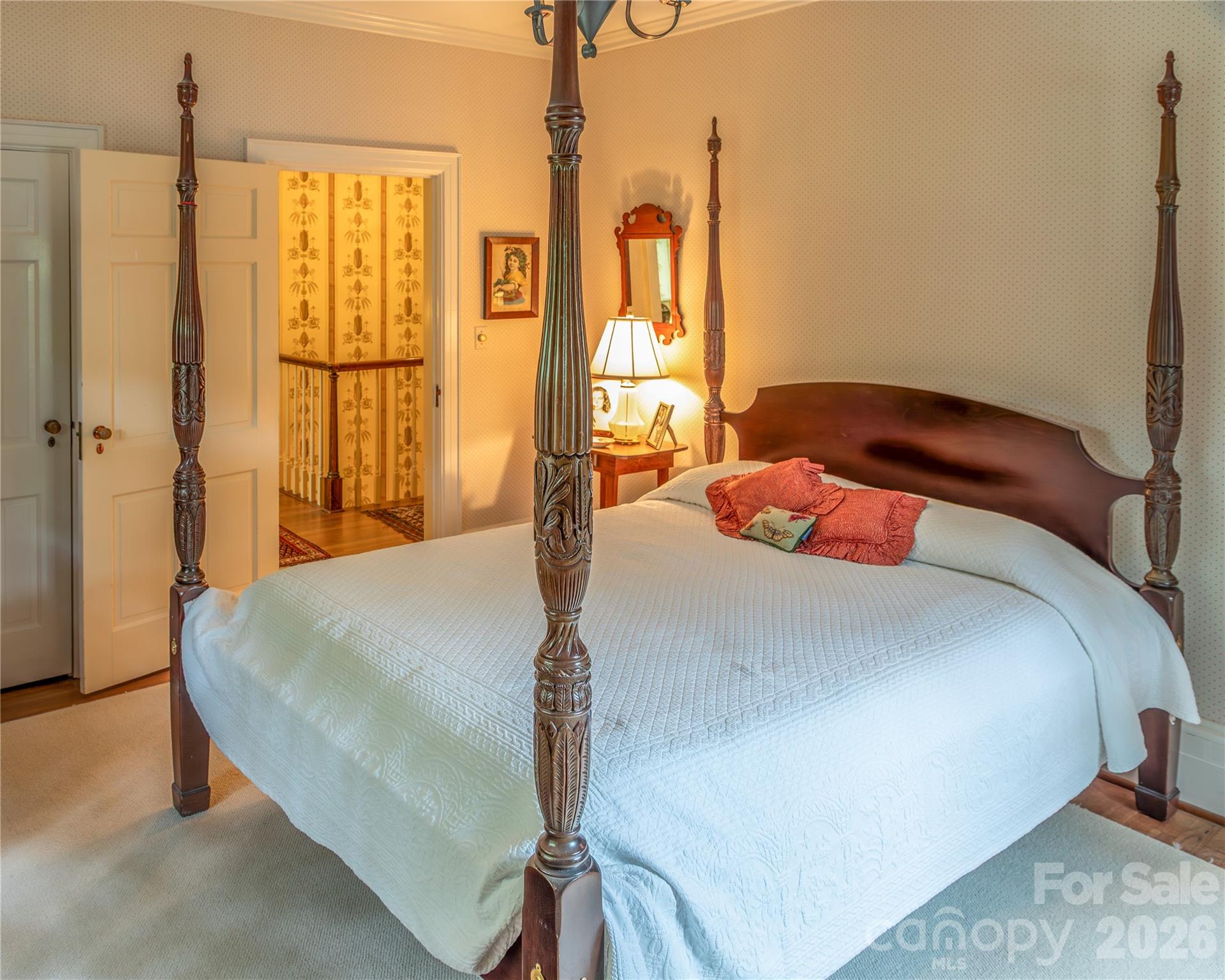 213 Union Street North Concord, NC 28025 - Photo 11 of 43 a bedroom with a large bed and a chandelier