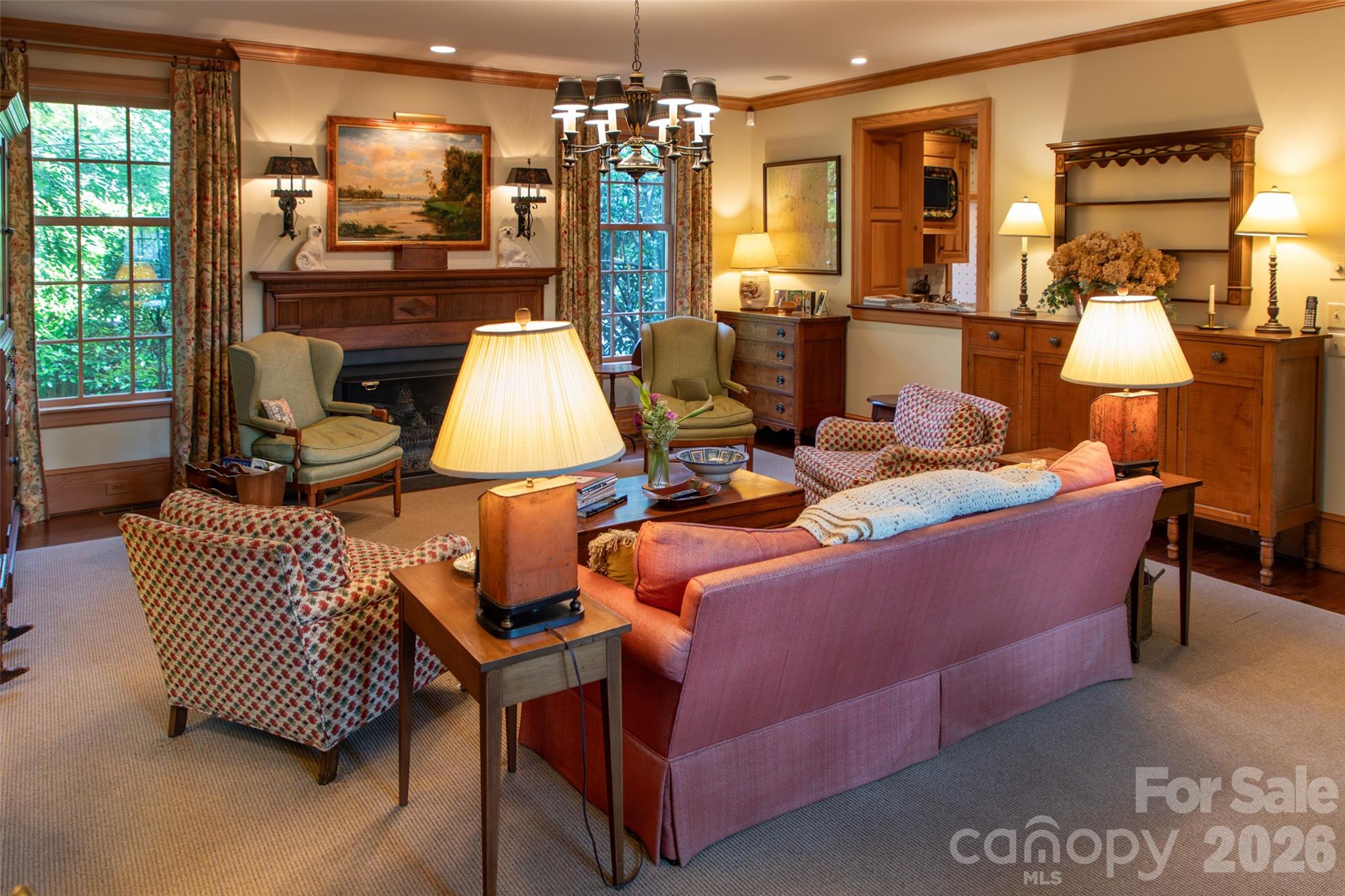213 Union Street North Concord, NC 28025 - Photo 21 of 43 a living room with furniture a chandelier and a dining table
