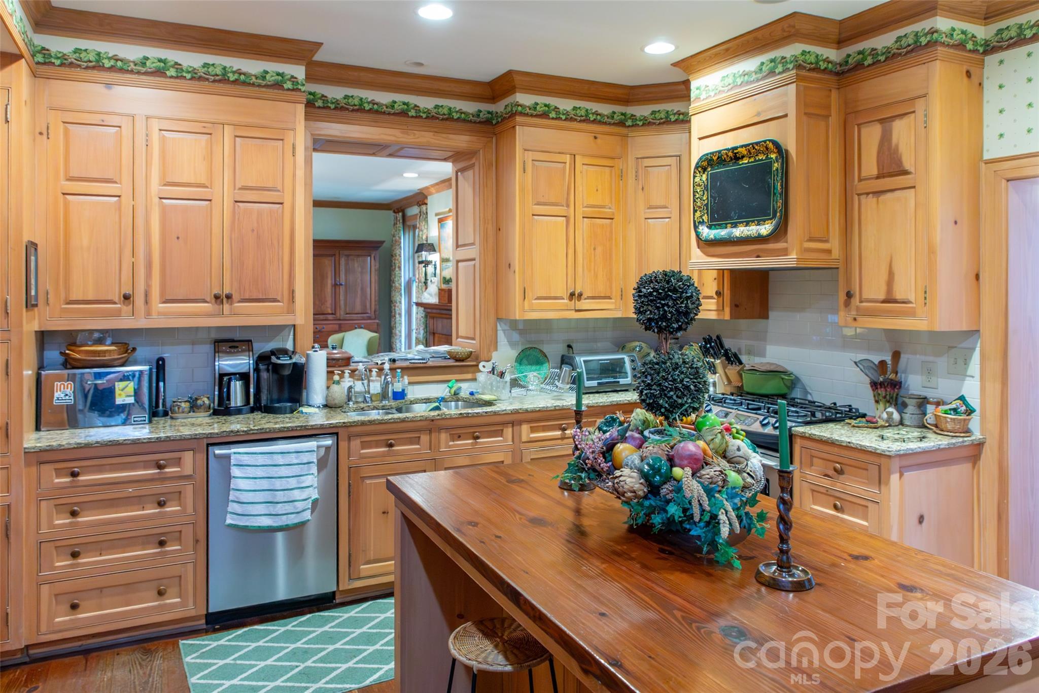 213 Union Street North Concord, NC 28025 - Photo 24 of 43 a kitchen with stainless steel appliances granite countertop a sink and cabinets