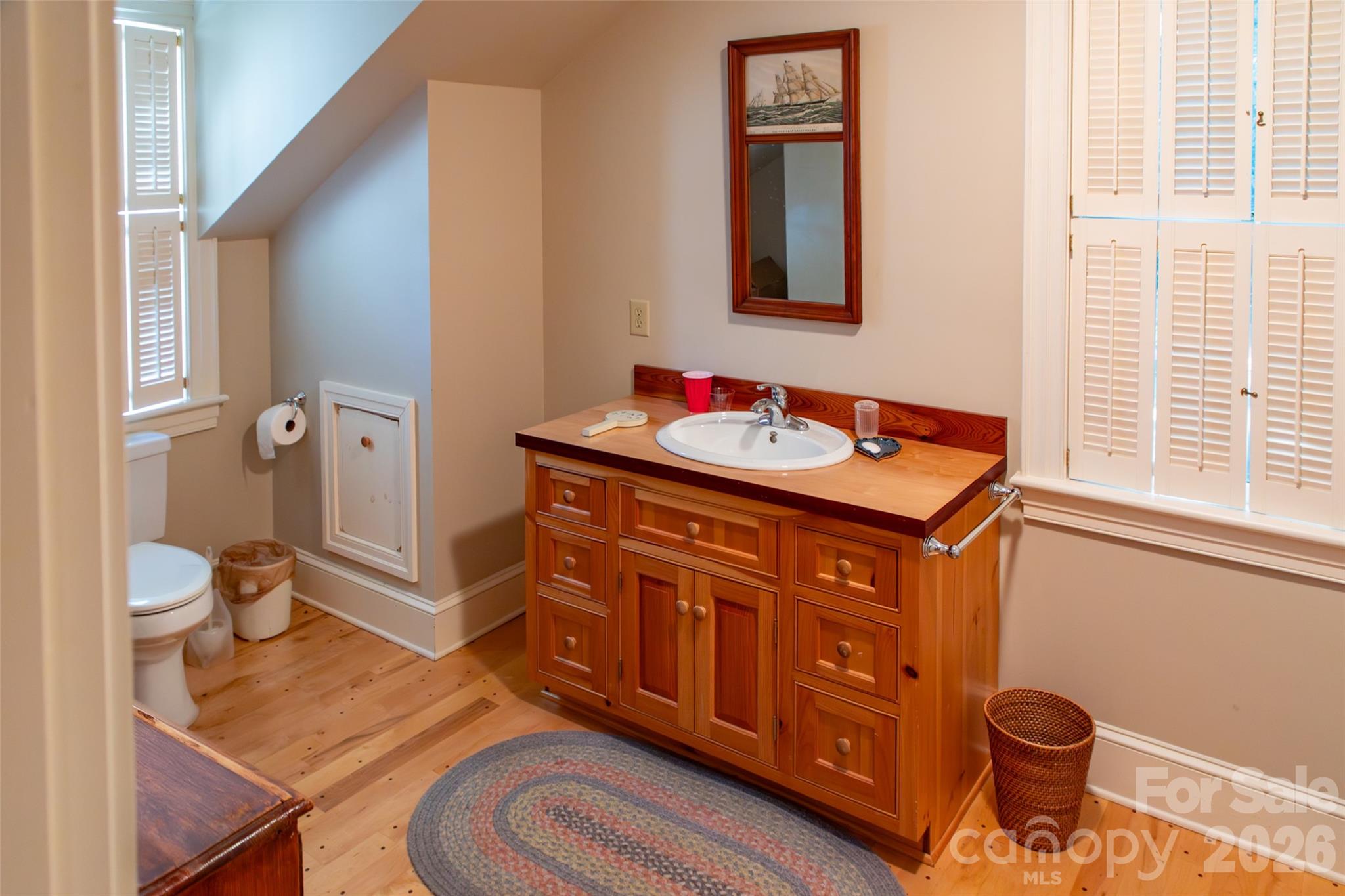 213 Union Street North Concord, NC 28025 - Photo 37 of 43 a bathroom with a sink a toilet and shower