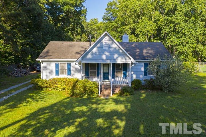 6720 Kiger Road Rougemont, NC 27572 - Photo 1 of 22 a front view of house with yard and green space