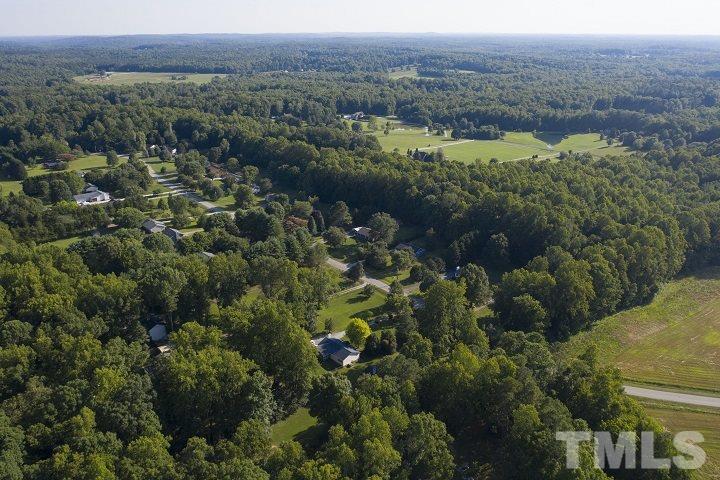 6720 Kiger Road Rougemont, NC 27572 - Photo 2 of 22 an aerial view of mountain and trees