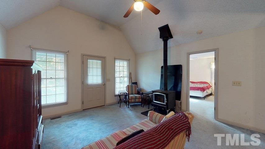 6720 Kiger Road Rougemont, NC 27572 - Photo 12 of 22 a living room with furniture and a window