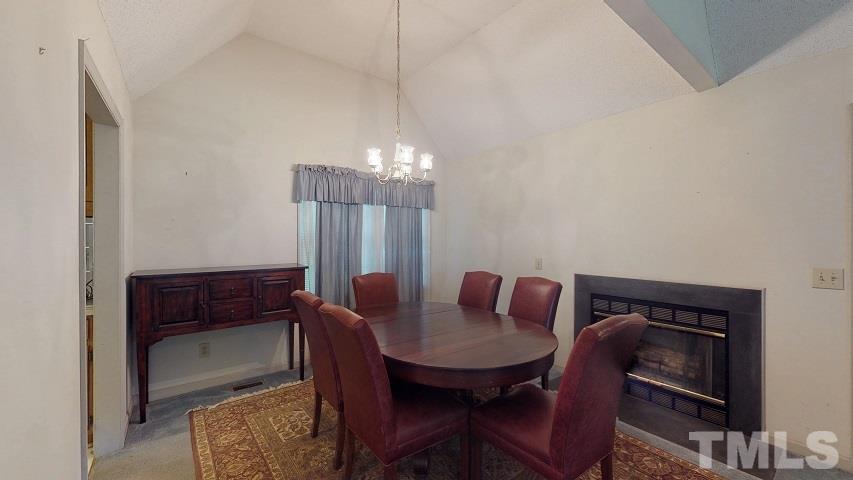 6720 Kiger Road Rougemont, NC 27572 - Photo 13 of 22 a view of a dining room with furniture and wooden floor