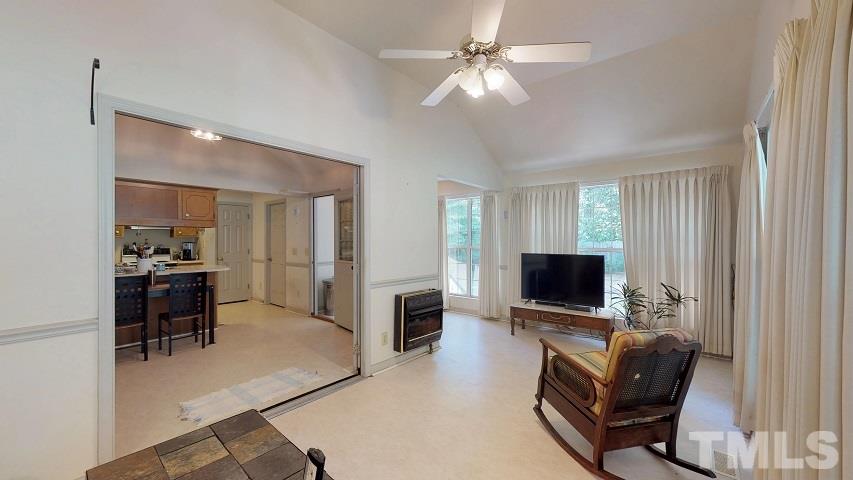 6720 Kiger Road Rougemont, NC 27572 - Photo 18 of 22 a living room with furniture and a flat screen tv