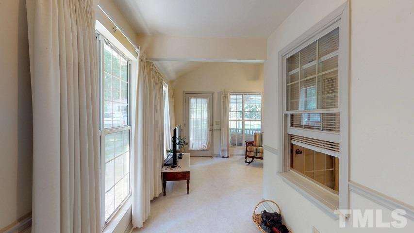 6720 Kiger Road Rougemont, NC 27572 - Photo 20 of 22 a view of a livingroom with furniture a fireplace and windows