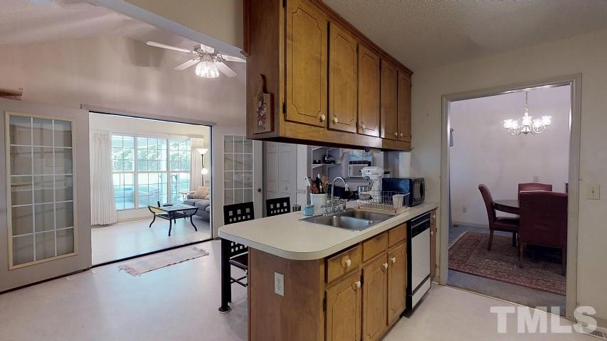 6720 Kiger Road Rougemont, NC 27572 - Photo 21 of 22 a kitchen that has a sink a table and chairs in it